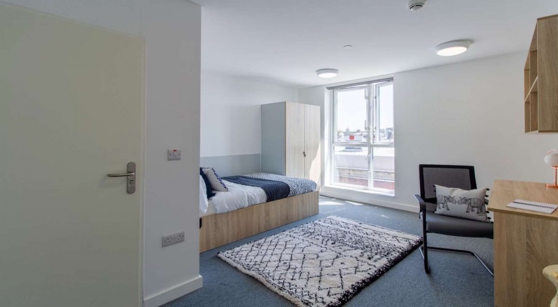 student room with bed, chair, and window at The Croft, Derby