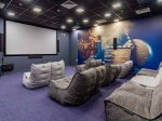 Comfortable cinema room with bean bag chairs at Plymouth Cross House