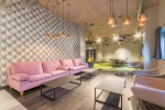 Spacious communal lounge area at Lumis Student Living with sofas