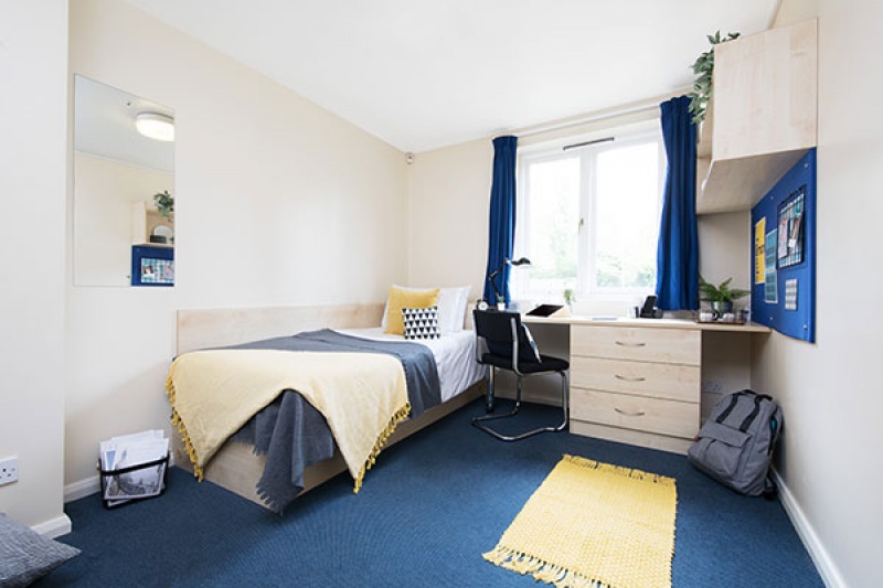 Single bedroom with study desk and chair in Calthorpe Court student accommodation