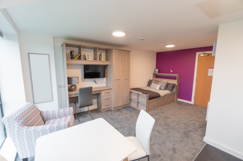 Stylish studio apartment with a kitchenette and en-suite bathroom at Unity Square, Liverpool.