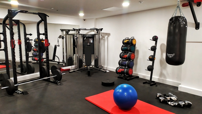 gym with all types of weights to train at the Student accommodation Paper Works