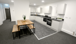 Communal kitchen for students, with storage, table and cooking area