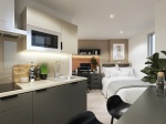 Well-designed kitchen in a corner studio at The Edge, showcasing modern appliances and ample storage