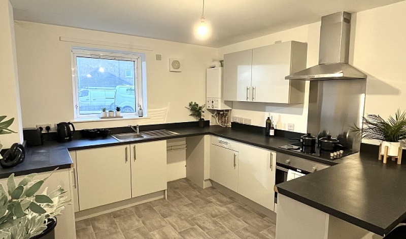 Shared kitchen area at Park Village, Sheffield. Fully equipped with modern appliances.