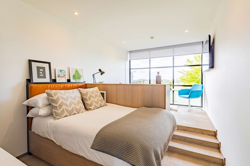 Comfortable bedroom setup with a desk and TV at Space St Andrews student accommodation