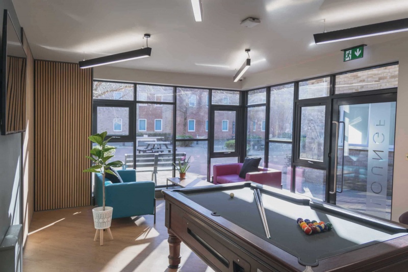 Comfortable communal lounge with seating and pool table in The Park, Oxford