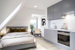 Modern student studio with double bed, study desk, and kitchen at Hydrogen Falmouth
