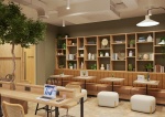 Cozy communal workspace with greenery and shelves at Fusion York