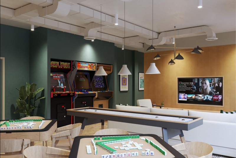 Entertainment lounge with arcade games and large TV at Fusion York