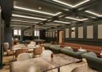 common room at Fusion Nottingham, featuring a mix of cozy seating and tables in a stylish, spacious 