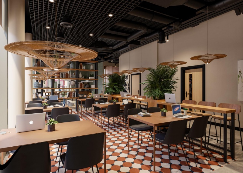 A stylish café and bar area in Fusion Nottingham, with modern seating, a large bar, and plants hangi