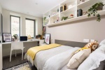 Private en-suite room at Stratford One accommodation, a comfortable bed, study desk