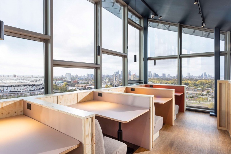 Modern study spaces at Stratford One student accommodation with desks, chairs, big windows