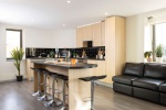 A communal kitchen area at Stratford One student accommodation with modern appliances 