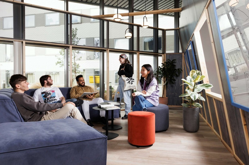 A spacious common area lounge at Stratford One student accommodation