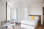 Modern bedroom with ample storage space at Felda House student accommodation in Wembley.