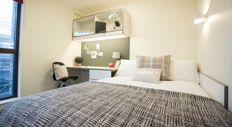 Modern en-suite room at Powis Place, Aberdeen with a comfortable bed and study desk