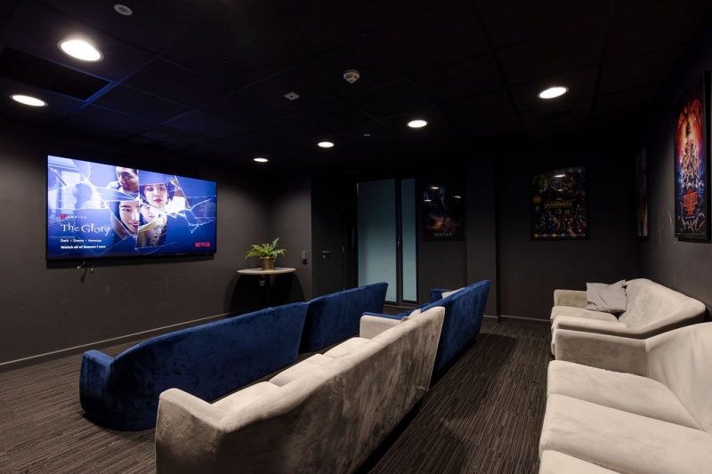 Comfortable communal lounge with seating and a large TV at Lumis Student Living, Leicester.