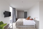 Modern bedroom with ample storage space at Lumis Student Living in Leicester