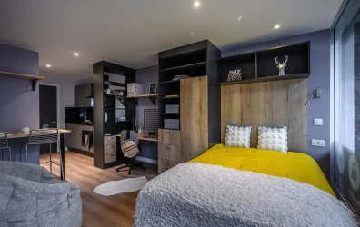 Comfortable student bedroom at Carters Yard with a double bed, desk, and built-in wardrobe
