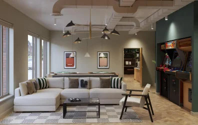 Comfortable lounge area with large windows and arcade games at Fusion York