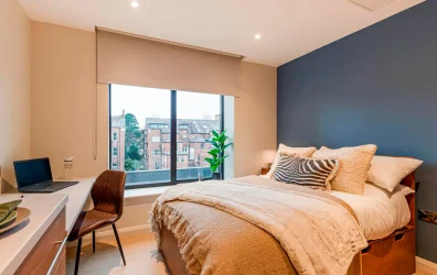 View of the Classic Plus studio at Ryan Hall, double bed, study desk and big window