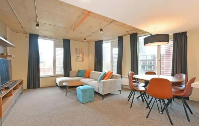 Spacious and modern share space at LIV Sheffield  with comfortable sofas and bright windows