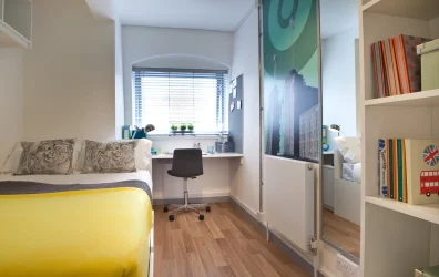 Modern bedroom with ample storage space at Orchard Lisle and Iris Brook student accommodation