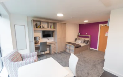 Stylish studio apartment with a kitchenette and en-suite bathroom at Unity Square, Liverpool.