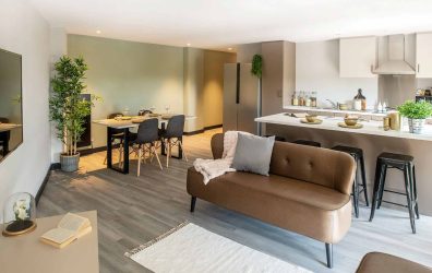 Modern open-plan living area with kitchen and dining space at Zenith student accommodation in Cardif